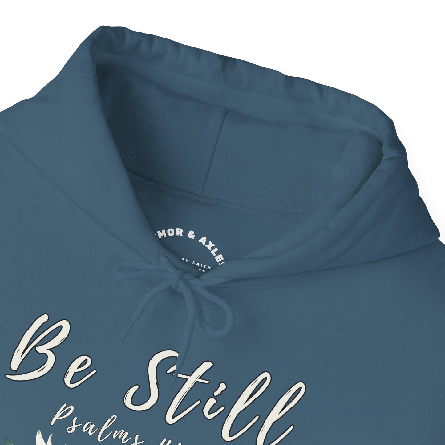 "Be Still" hooded sweatshirt with Psalms 46:10 Bible verse.