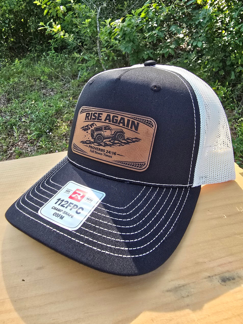 Rise Again | Proverbs 24:16 Leather Patch Trucker Hat