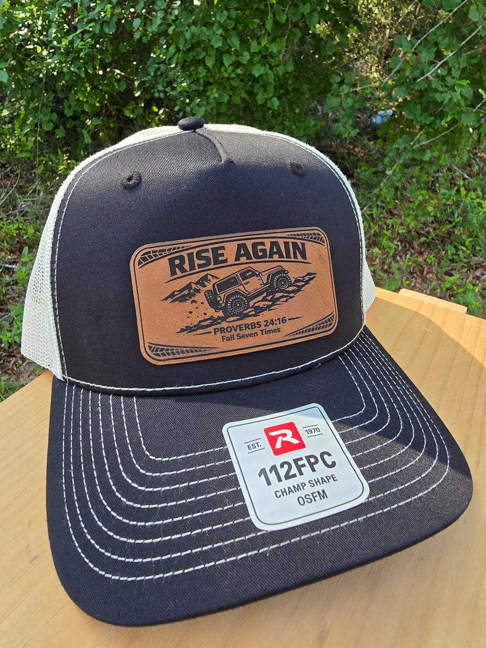 Rise Again | Proverbs 24:16 Leather Patch Trucker Hat