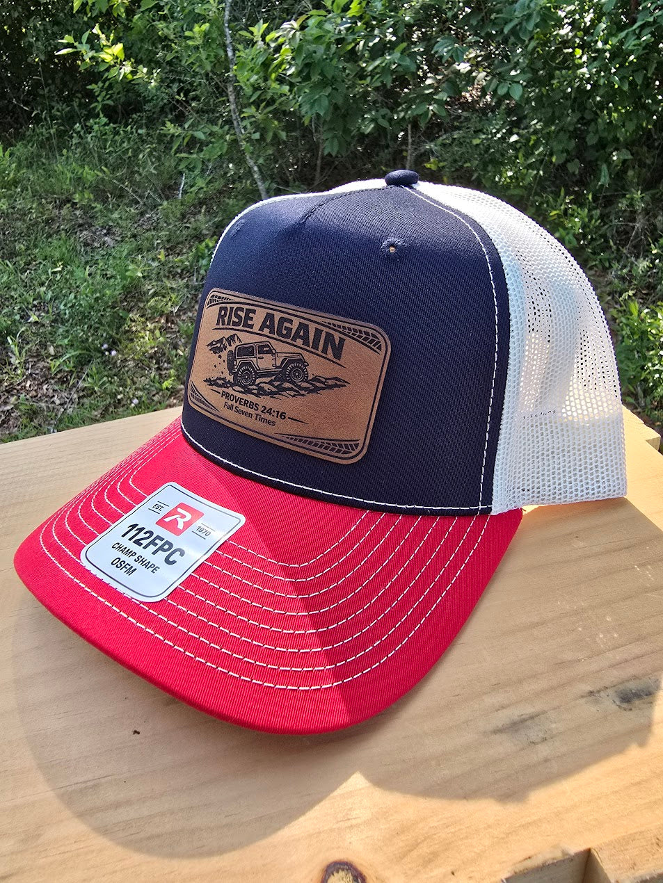 Rise Again | Proverbs 24:16 Leather Patch Trucker Hat