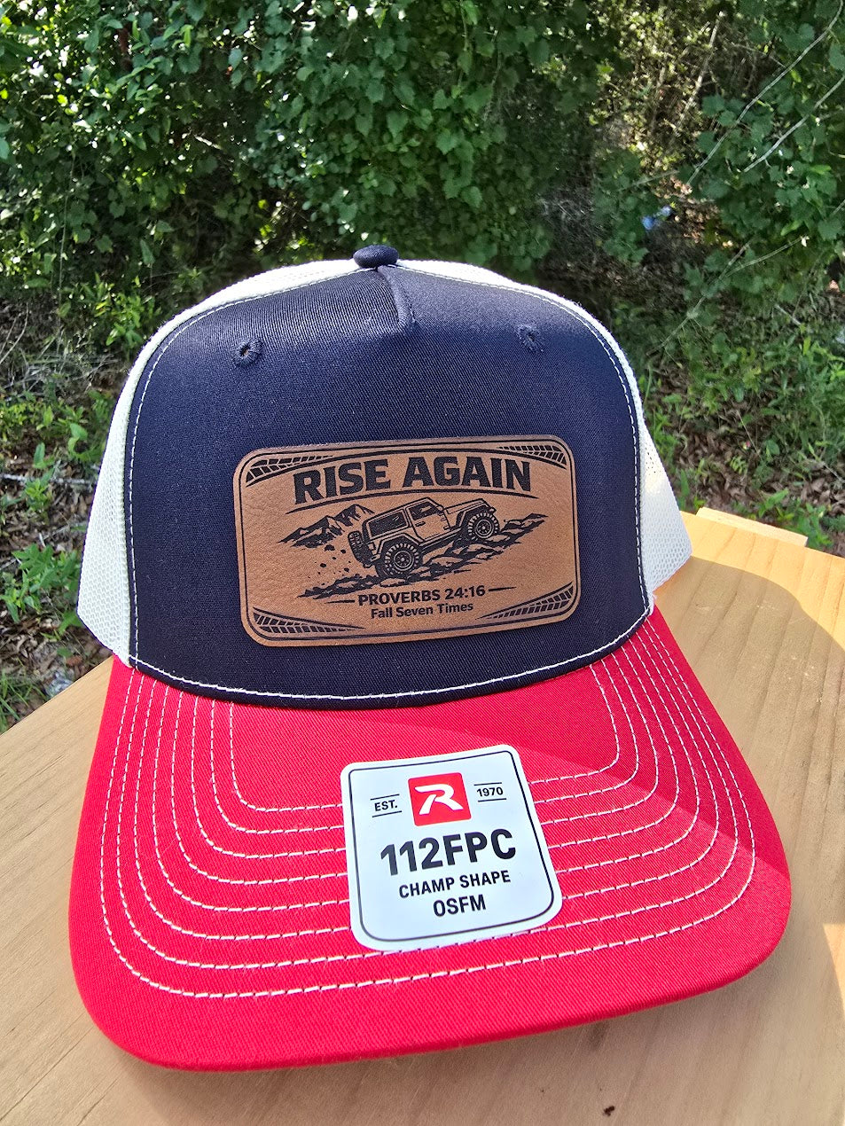 Rise Again | Proverbs 24:16 Leather Patch Trucker Hat