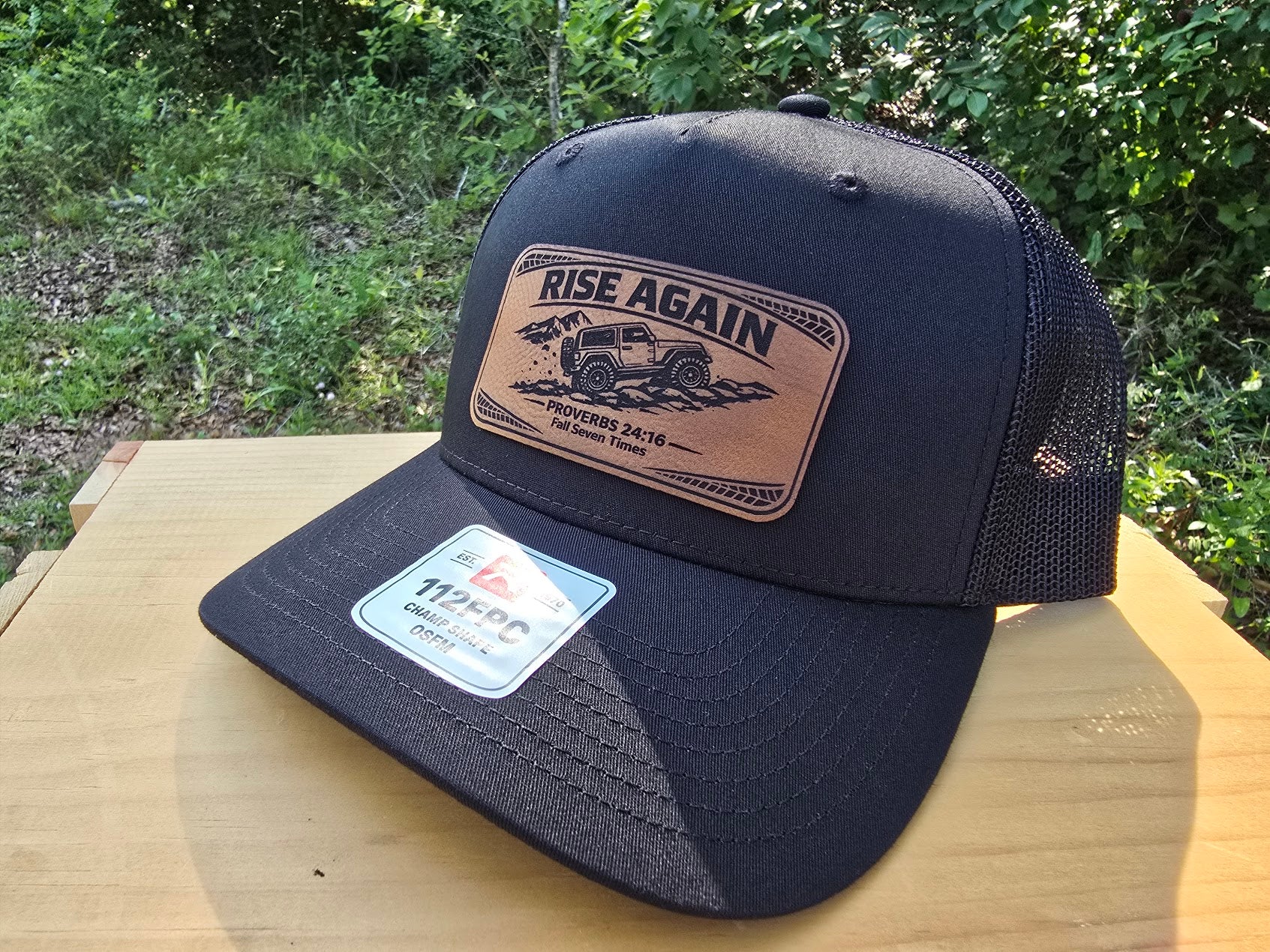 Rise Again | Proverbs 24:16 Leather Patch Trucker Hat